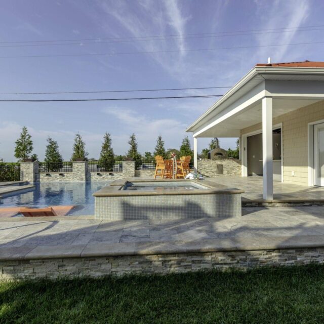 outdoor living area with pool by ashton pools by design