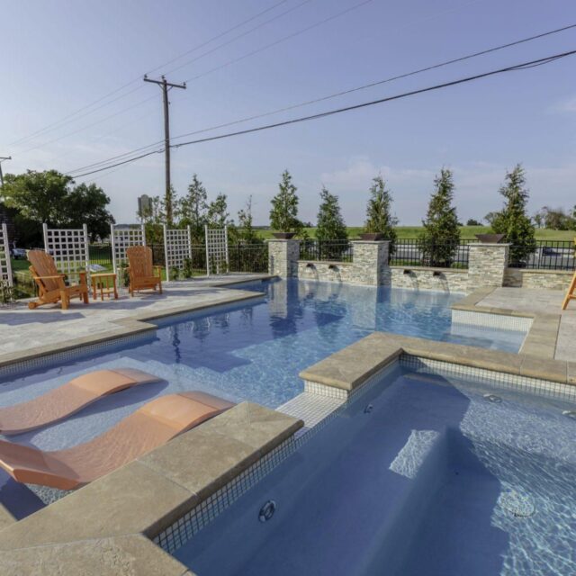 outdoor swimming pool with hot tub by ashton pools by design