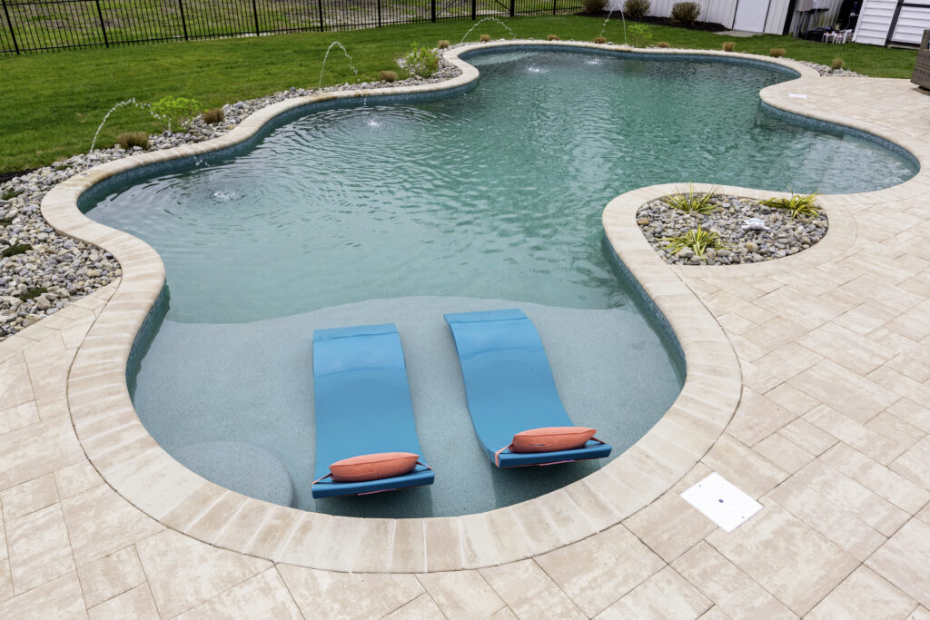 Freeform Swimming Pool with Deck Jets and Tanning Ledge, Ledge Lounger