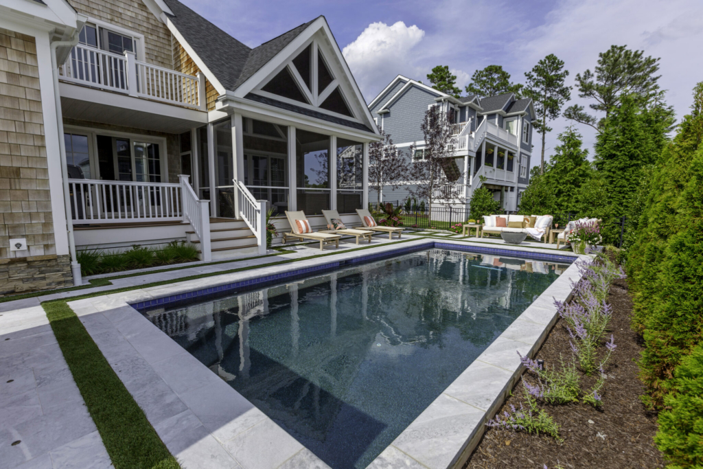 photo of a beautiful backyard with a pool, and landscaping. Financing this pool could be an option