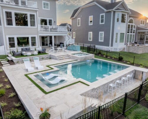 Dream pool with tiers, custom spa, fire pit and swim up bar