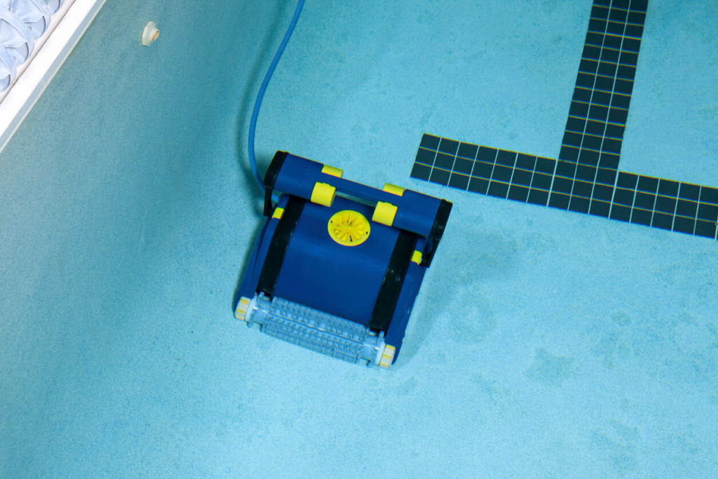 Robotic pool cleaner maintaining a self-cleaning swimming pool