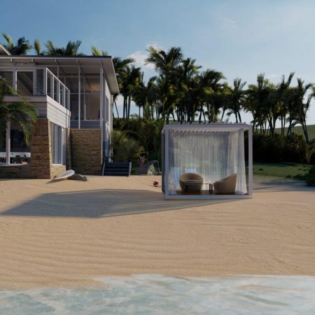 Modern beachfront house with large windows, palm trees in the background, luxury pool, and a shaded outdoor seating area on the sandy beach near the water.