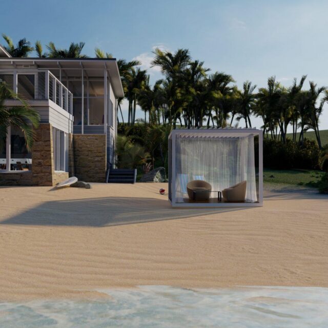 Modern beachfront house with large windows, palm trees in the background, luxury pool, and a shaded outdoor seating area on the sandy beach near the water.